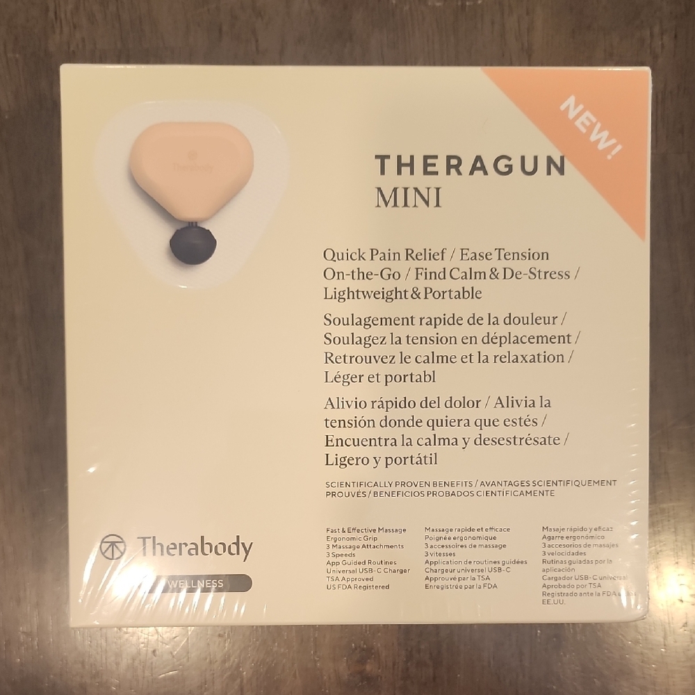 Theragun Mini in Cream and Black